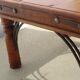 Square coffee table in exotic wood and wrought iron.