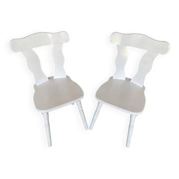 Pair of vintage white wooden bistro chairs