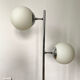 Vintage floor lamp has two opaque glass spheres