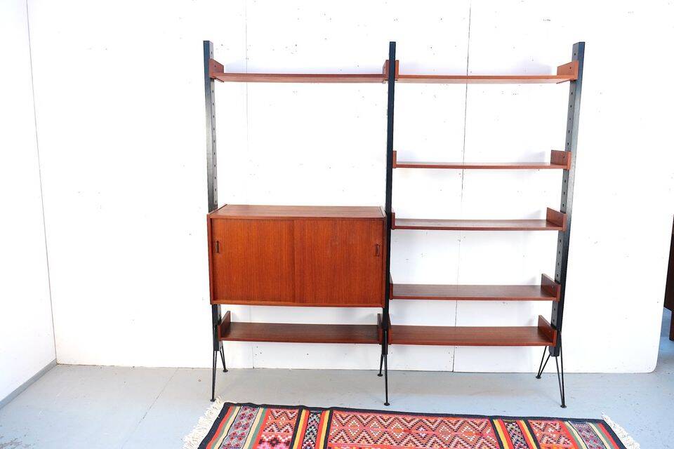 Vintage teak shelving system in 60s-70s style, retro style.