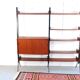 Vintage teak shelving system in 60s-70s style, retro style.
