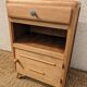 Vintage bedside table with compass legs