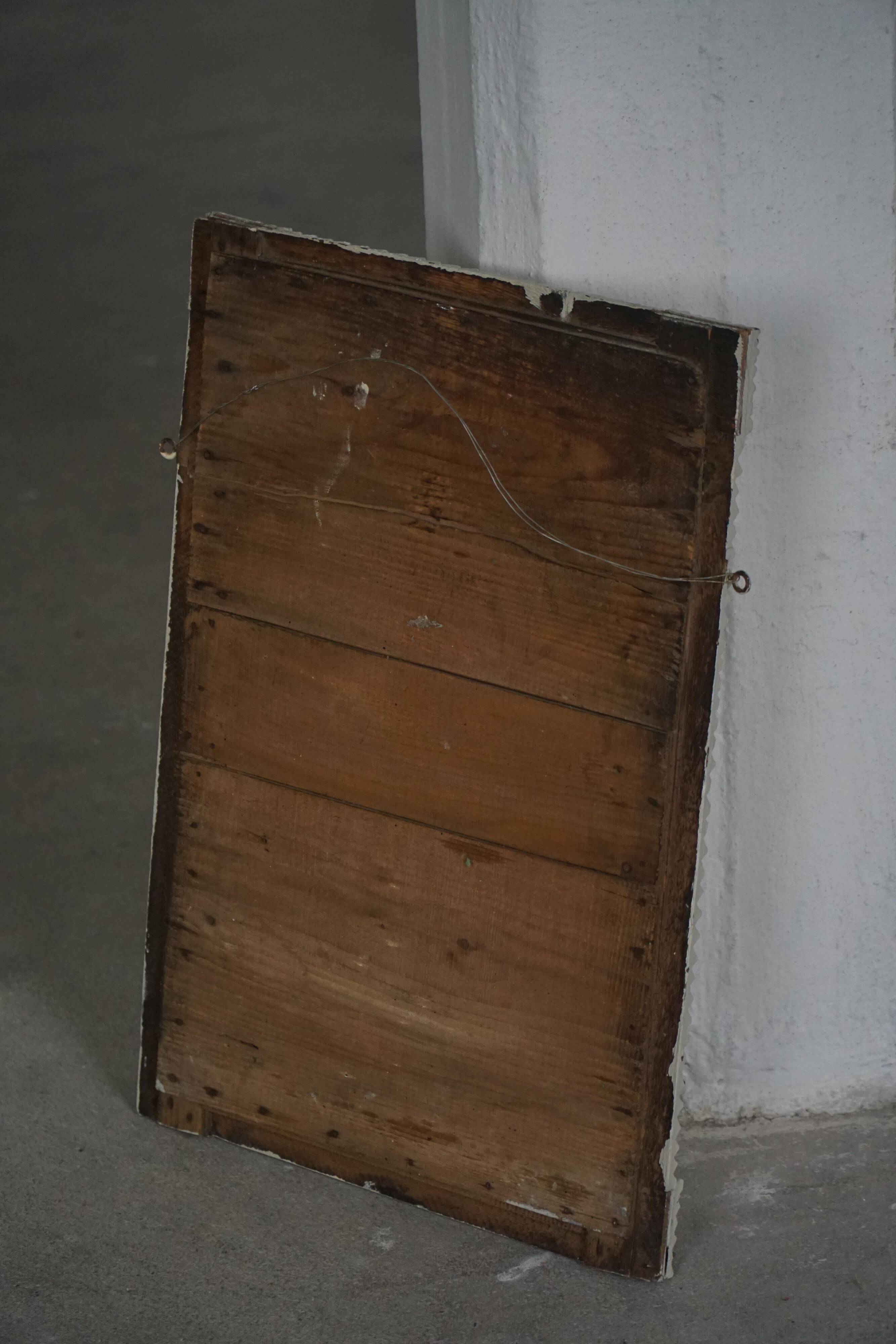 Wall mirror in tramp art style, hand-carved with a painted white frame, early 1900s.