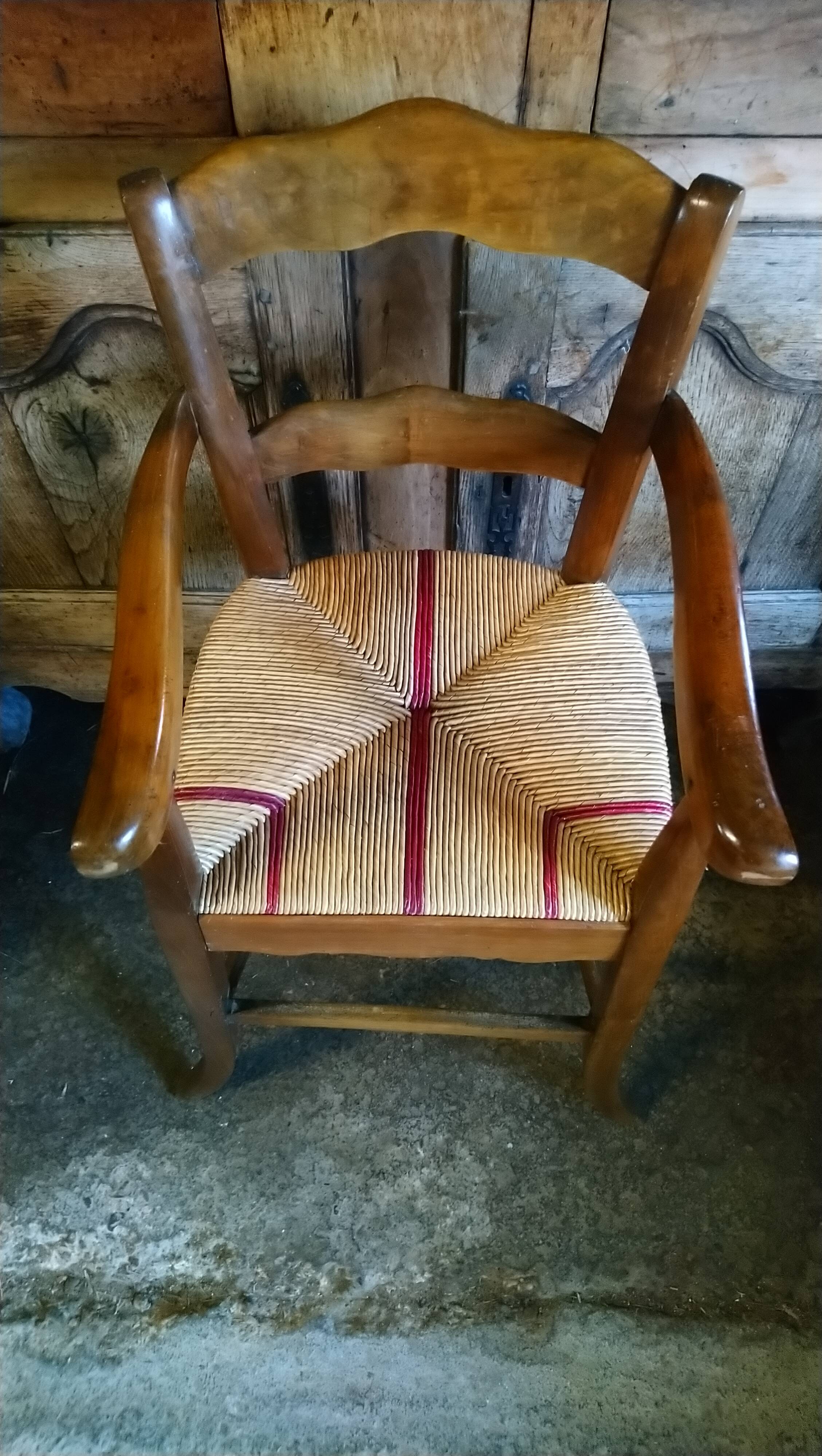 Child's high chair with a rush seat in walnut