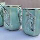 Set of 4 Art Deco celadon green and silver barbotine pots.