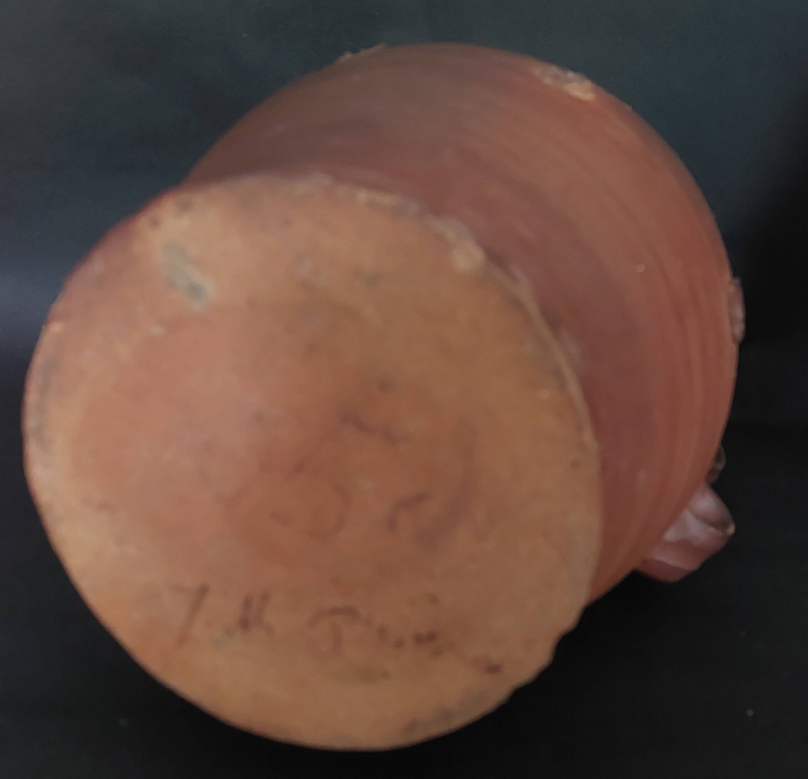Vintage pitcher with a signature to identify.