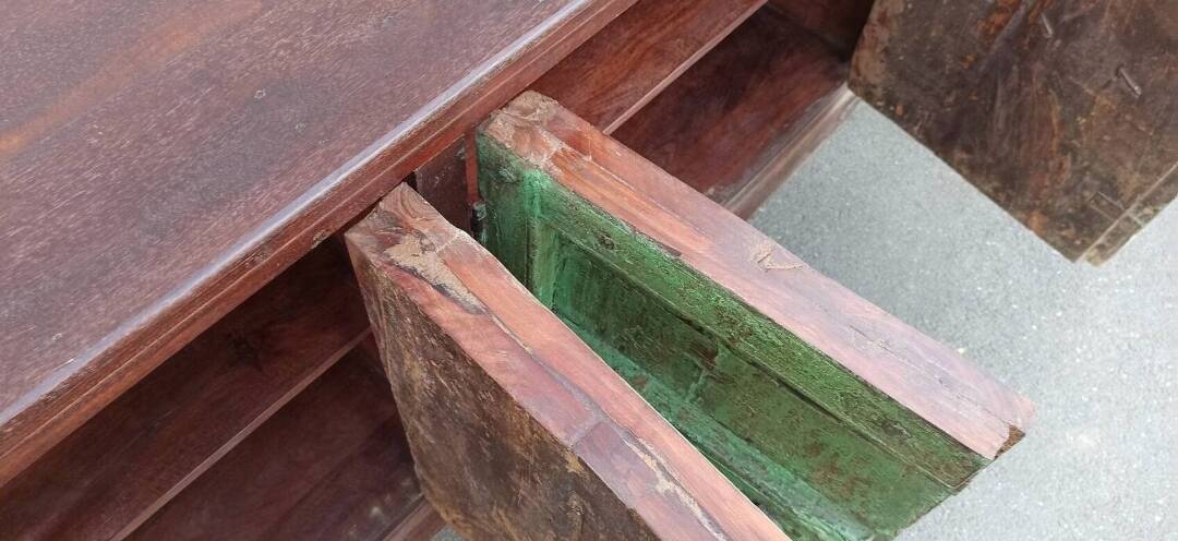 Long wooden sideboard with old green doors