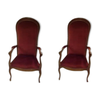 2 red voltaire armchairs
