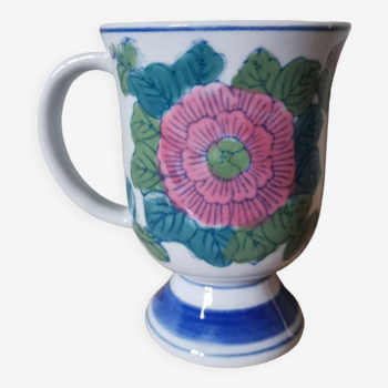 Vintage porcelain mug with vintage flower pattern