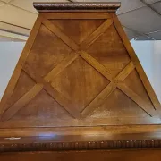 Important architectural fireplace made of solid wood, dating from the 19th century.