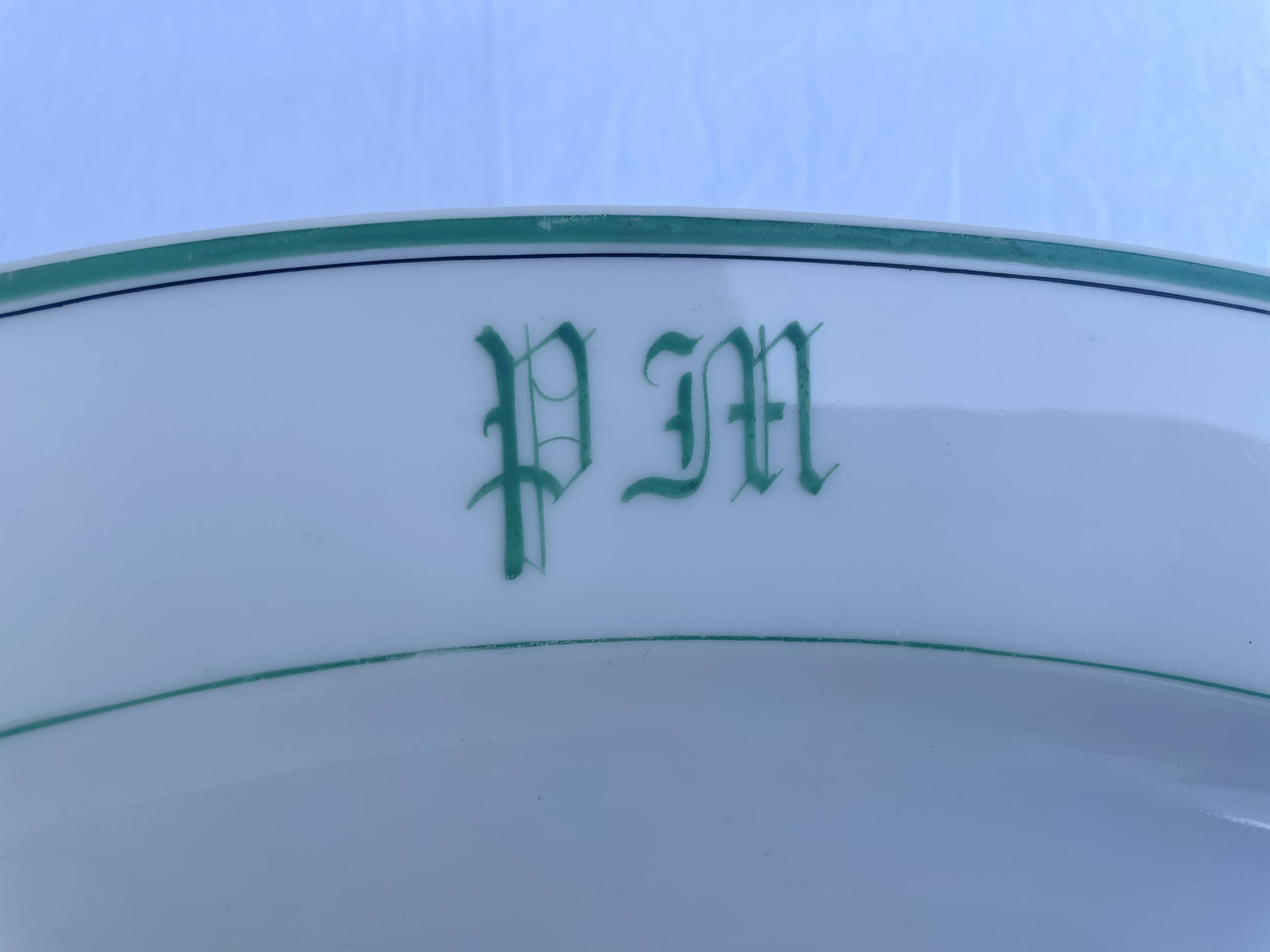 Antique oval plate with green monogram