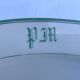 Antique oval plate with green monogram