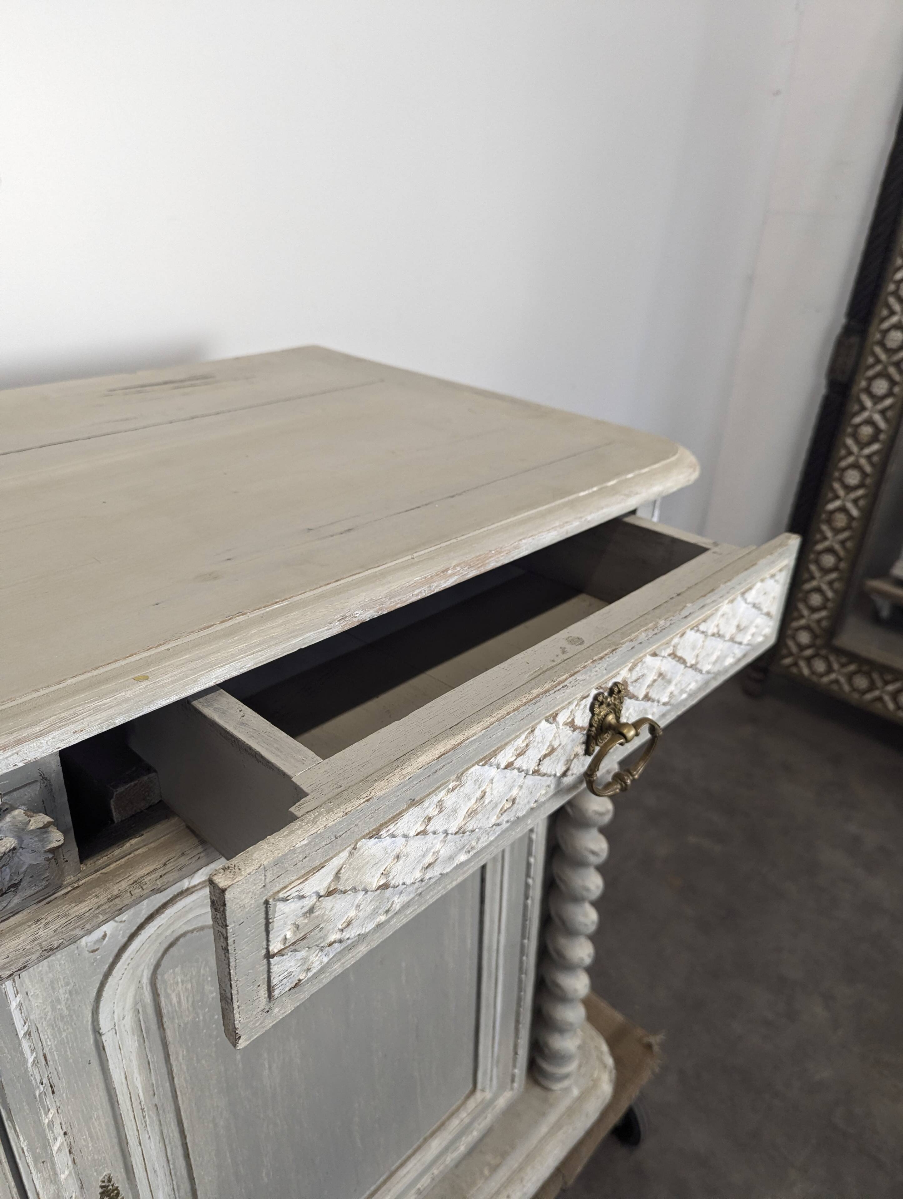 Louis XIII buffet with twisted column in grey patinated oak, two doors, two drawers.