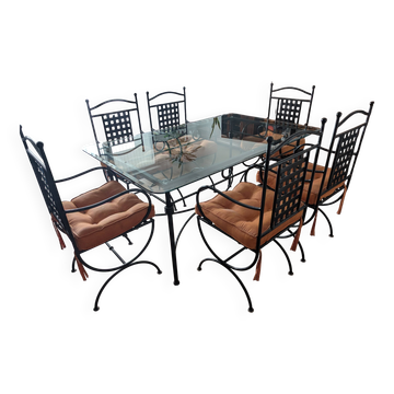 Wrought iron table made in Mexico and 6 chairs.