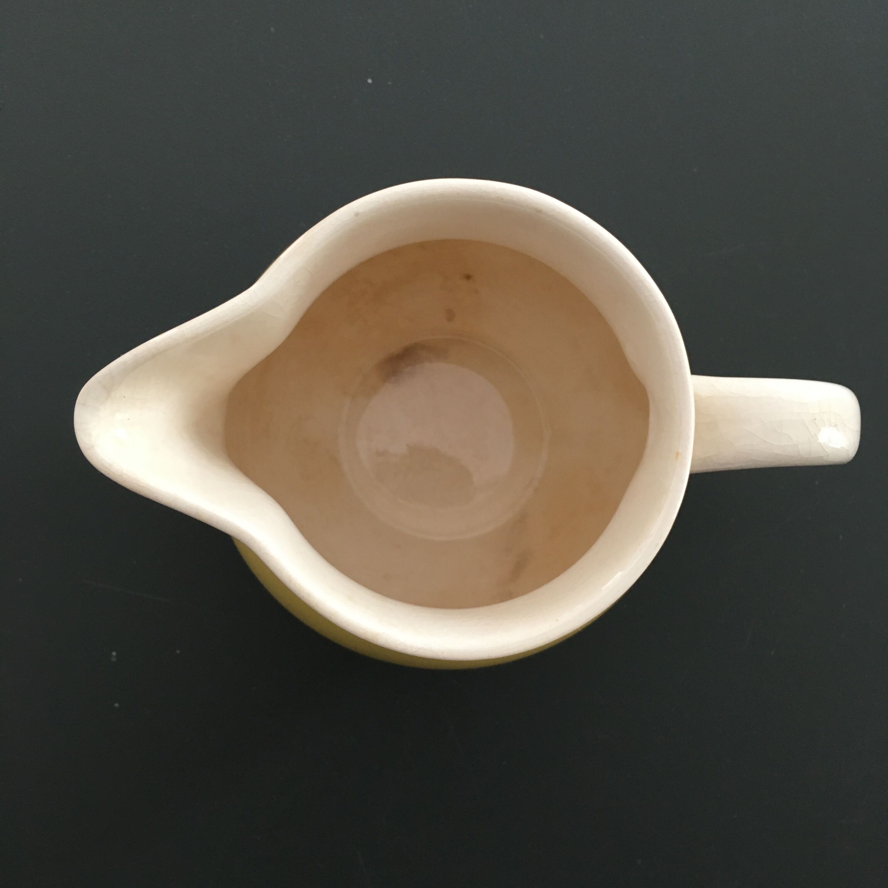 Yellow straw and ivory pitcher