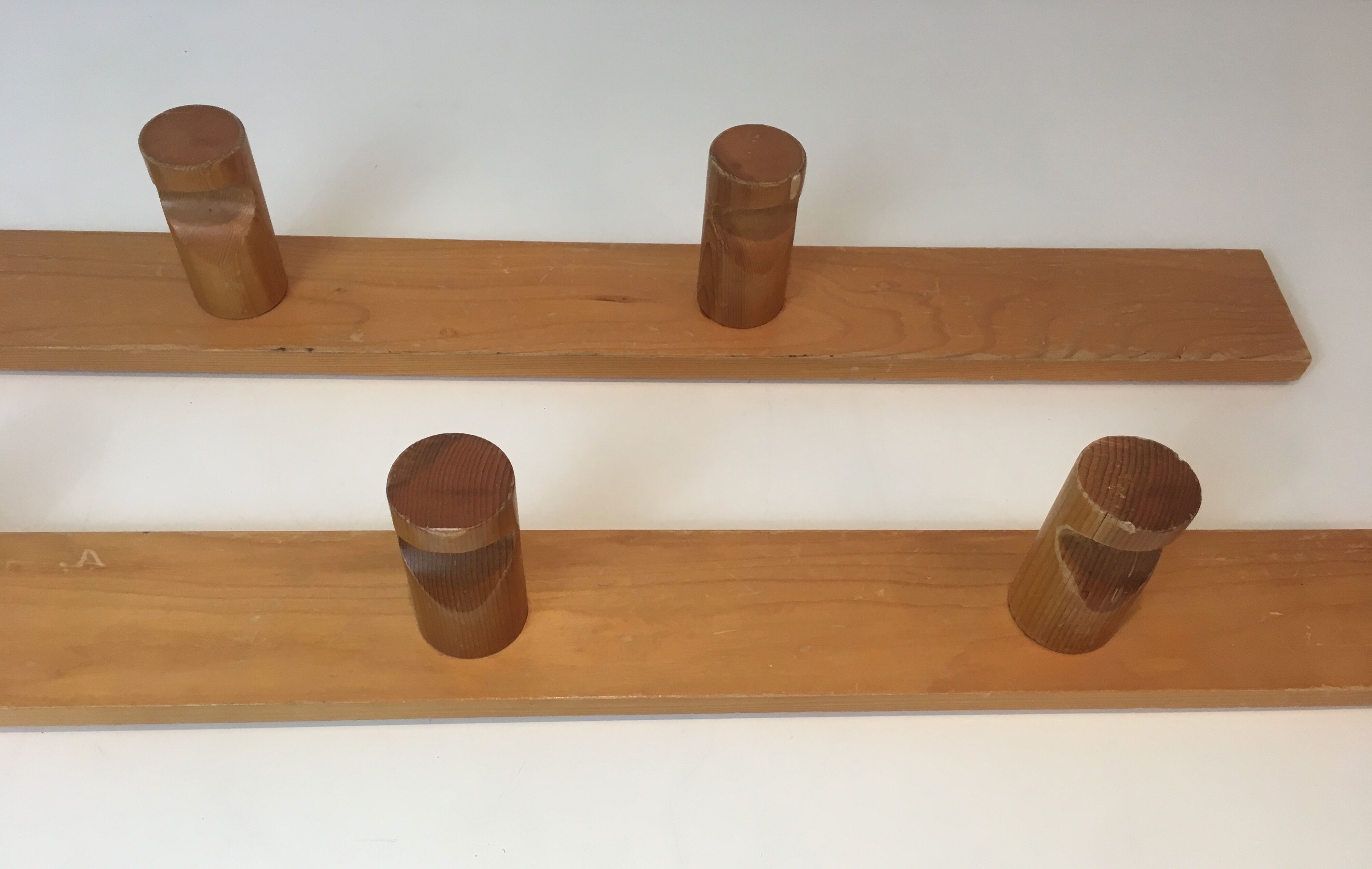 Charlotte Perriand, pair of fir wall coat racks, French work, around 1970