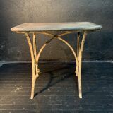 Ancient wrought iron and wood garden table