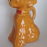 Ancient ceramic pitcher in the shape of a poodle.