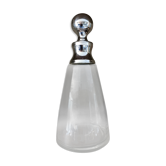 Old glass and silver metal carafe