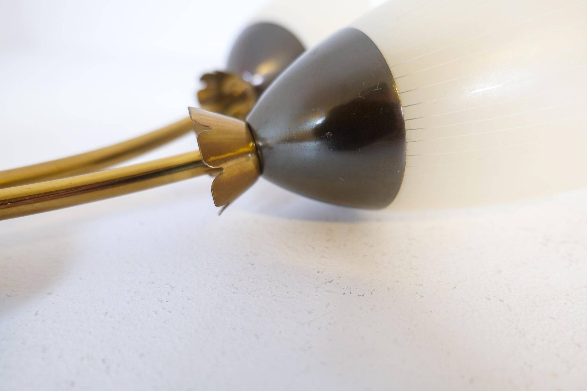 Mid-century pair of wall lamps in brass and opaline attributed to Asea Sweden, 1950s.