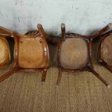 4 mismatched signed bistro chairs
