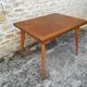Oak table has two vintage extensions
