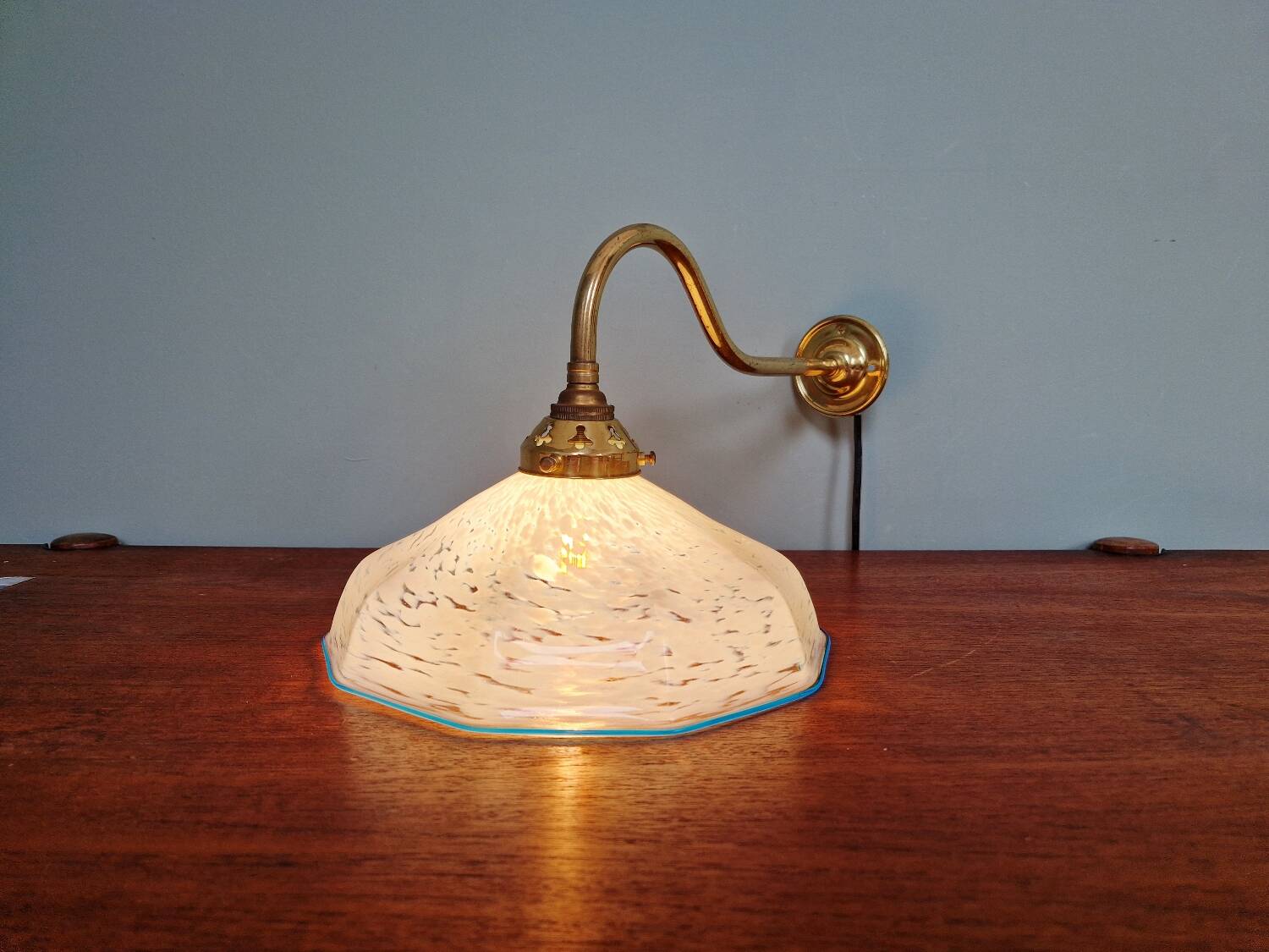Brass and blue speckled glass wall light