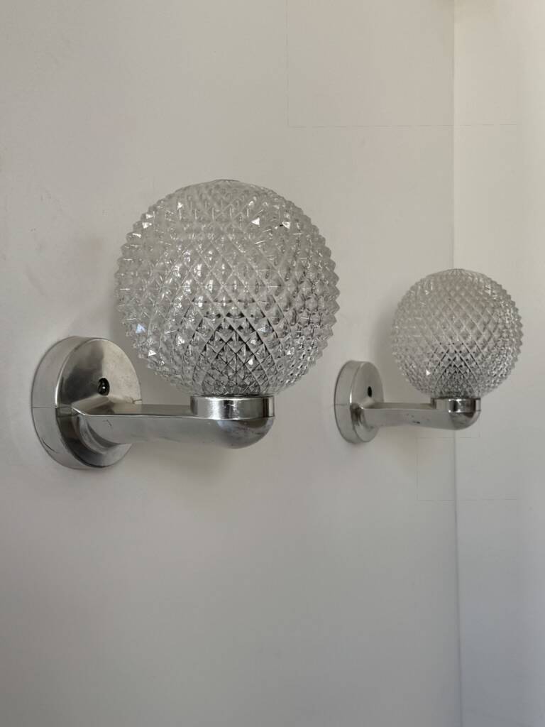 Pair of vintage wall lights in chrome metal and pressed moulded glass, France, 70s.