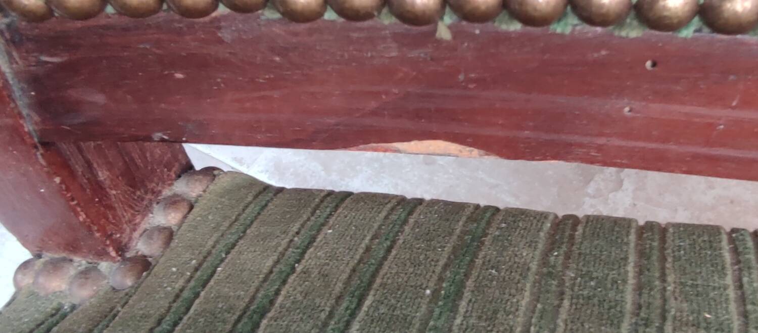 Old green velvet armchair