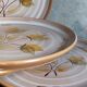 Six assiettes en grès de Niderviller au décor végétal vintages