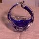 Ashtray in transparent and blue blown glass with a design shape