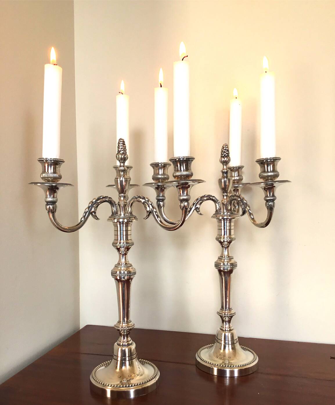 Pair of Louis XVI style silver-plated metal candelabras. Chrysalia house