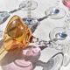Twisted foot glasses of different color