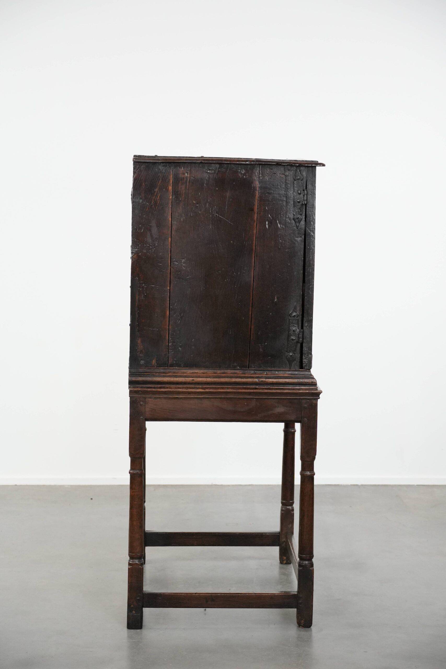 Unique antique English cabinet on stand made of oak from the 17th century
