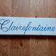double-sided wooden panel with carved inscription "Clairefontaine"