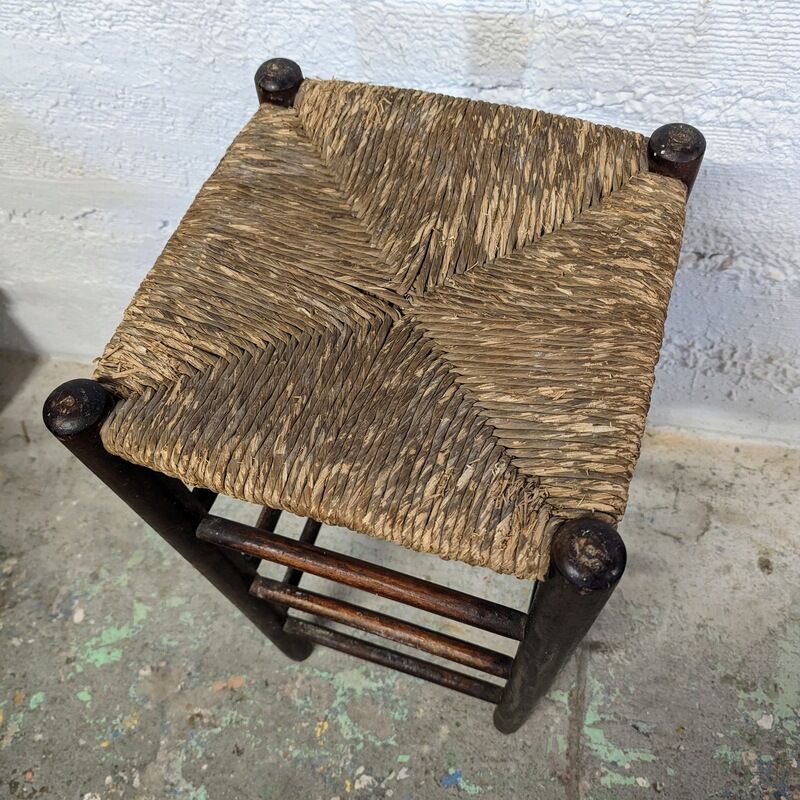 High wooden stool and straw