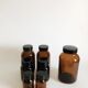 Lot of 7 bottles of amber glass apothecary style
