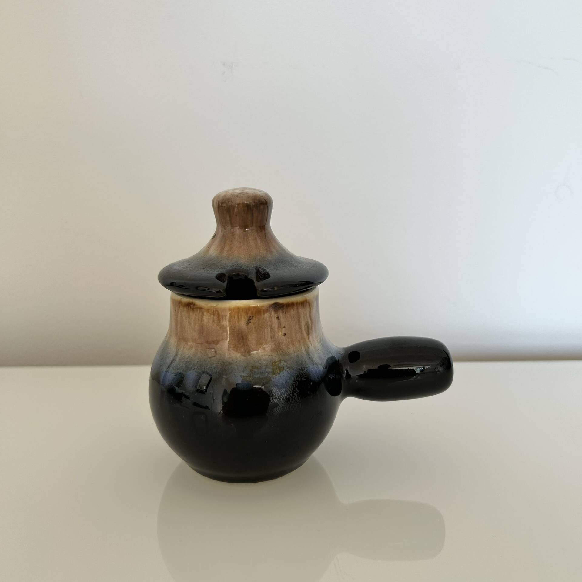 Blue flamed and black condiment pot