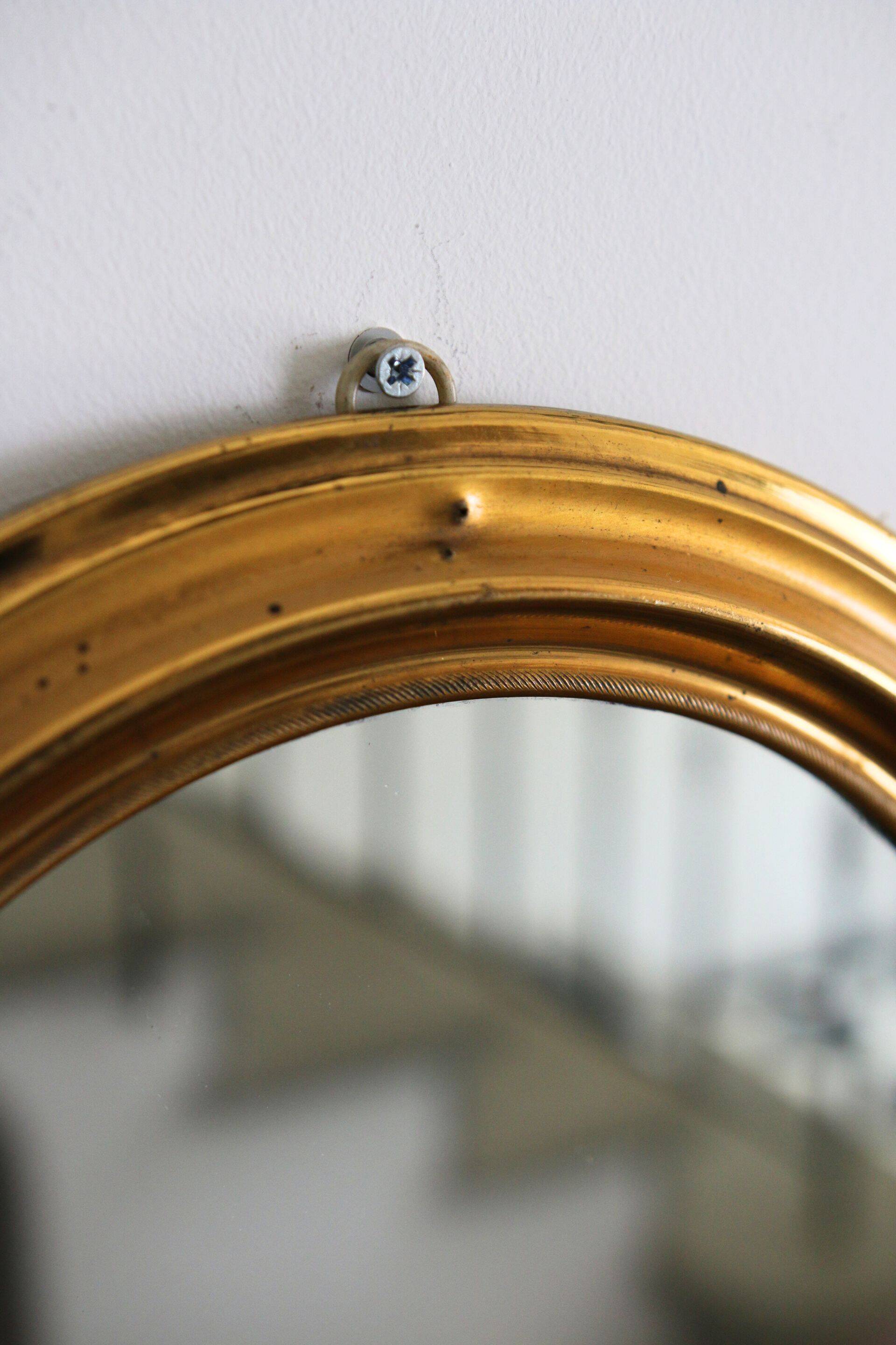 Oval brass mirror