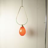 Hanging lamp with a brass frame in the shape of scales and a red-purple Murano glass diffuser.