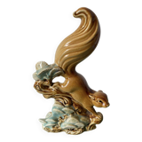 Ceramic squirrel on branch