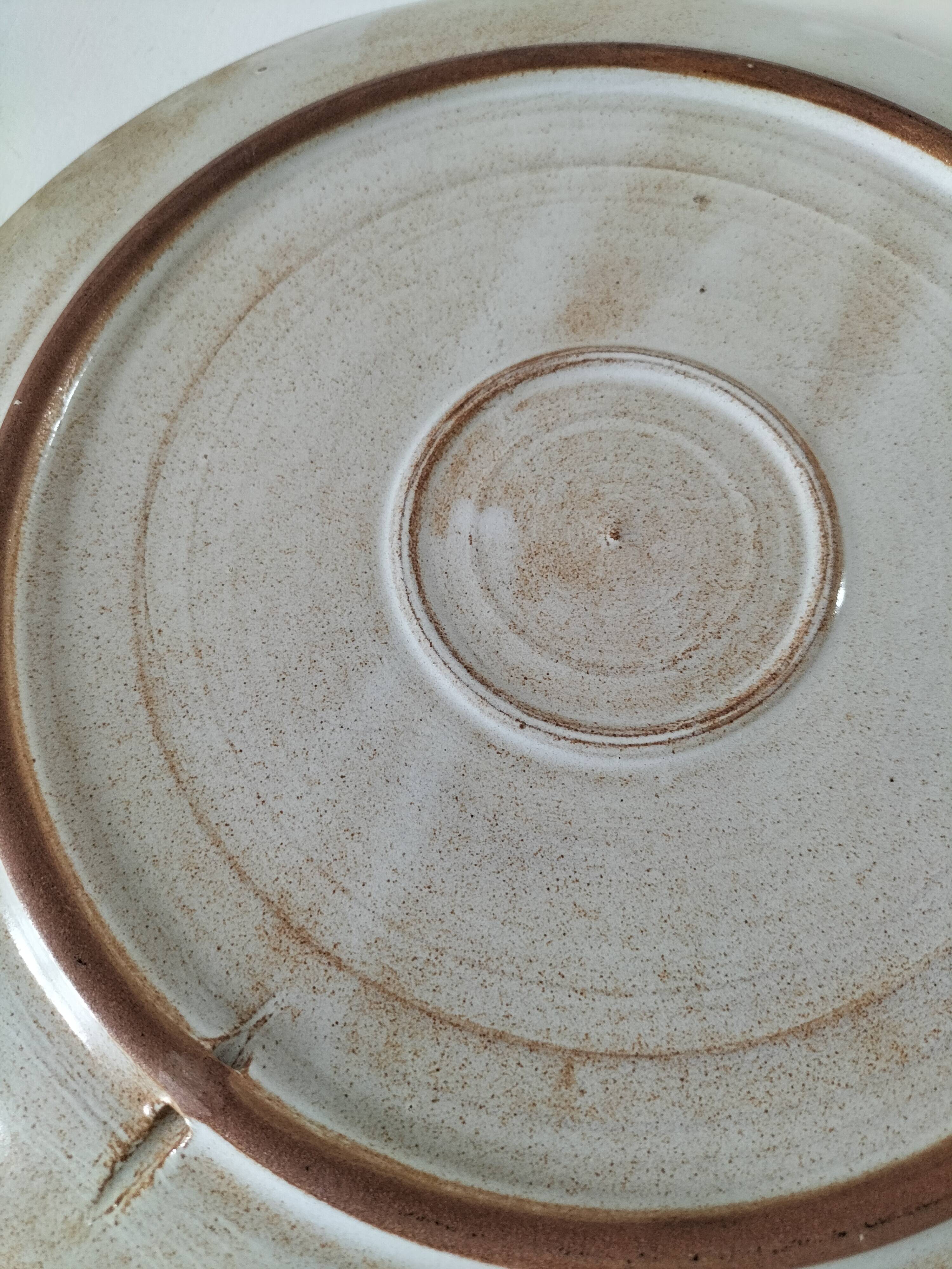 Stoneware plate with hand-painted floral decoration