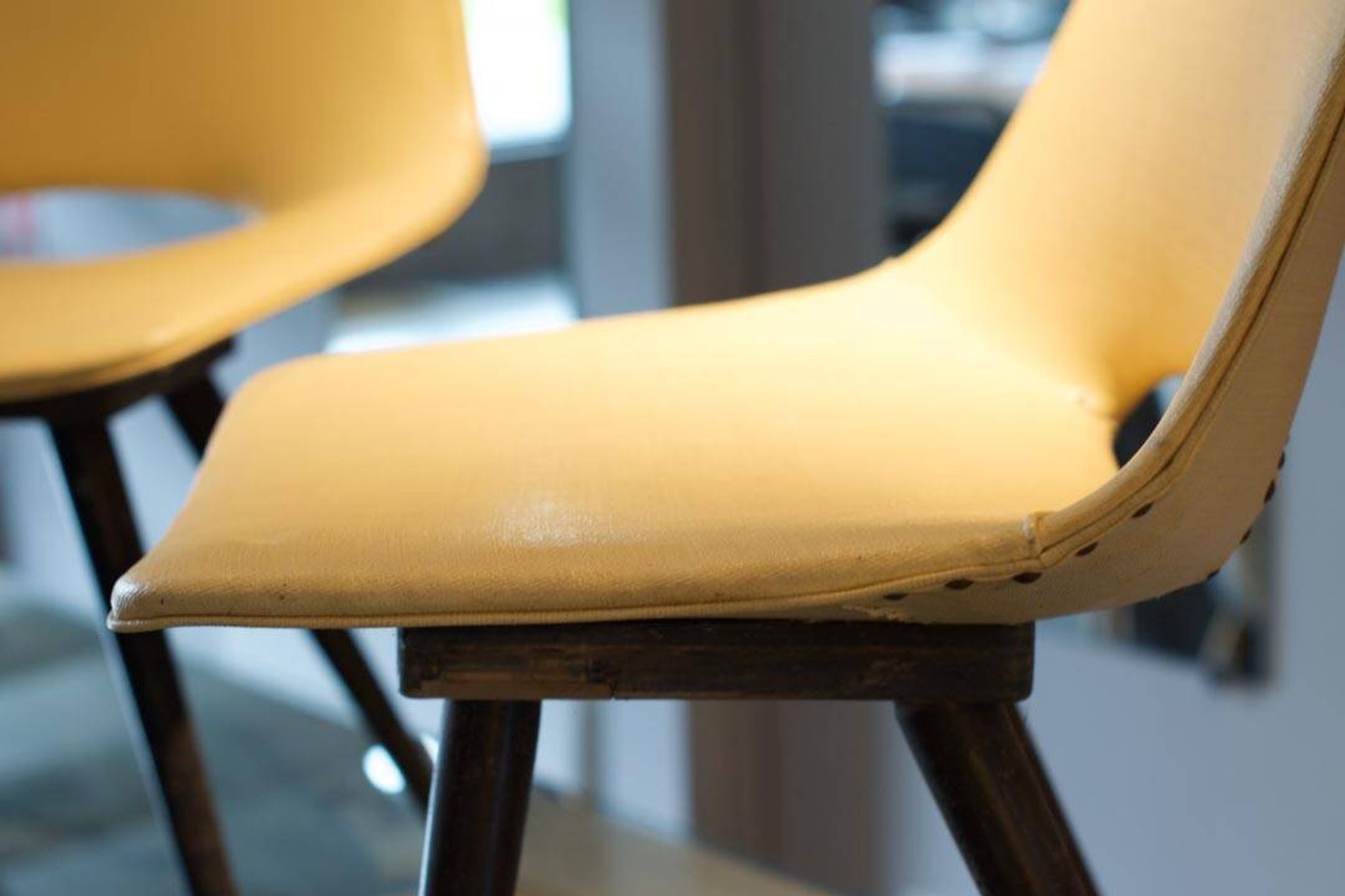 Pair of yellow “Tonneau” chairs Pierre Guariche edition Thonet 1950
