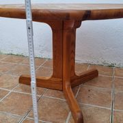 Scandinavian coffee table in solid pine with tripod legs in Swedish chalet style.