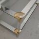 Coffee table, living room table in glass with two tiers, adorned with golden seashells, 1970.