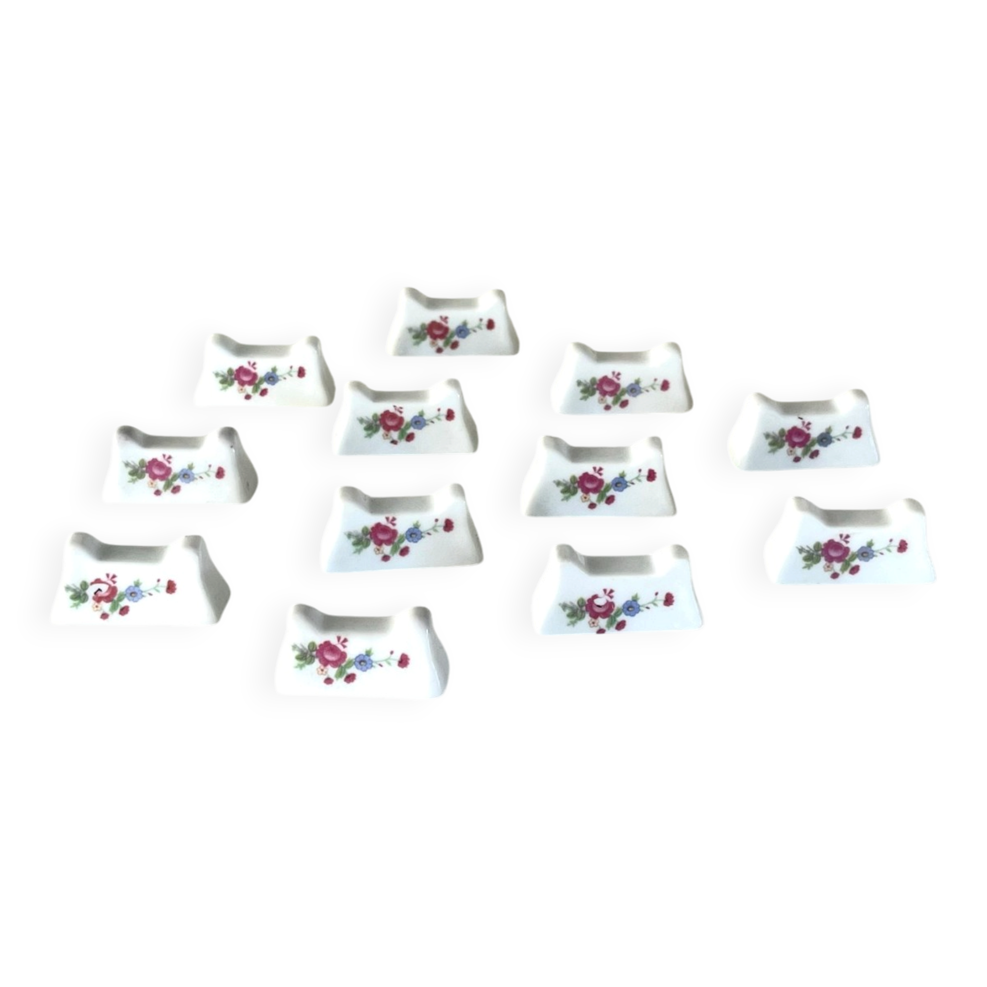 Ensemble de 12 repose-couteaux en porcelaine française avec motifs floraux