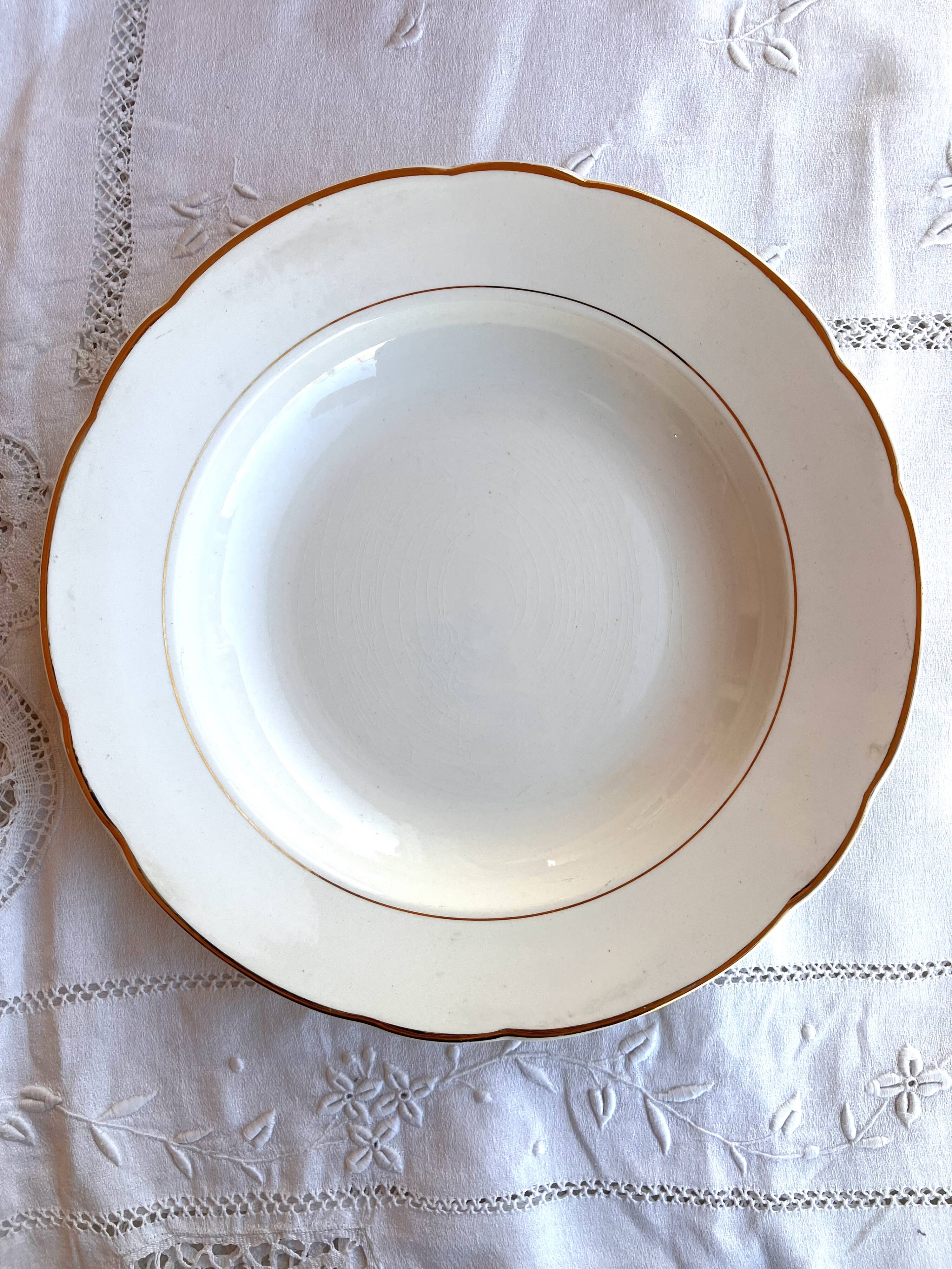 Service of 53 pieces of plates and dishes by Villeroy & Boch in cream and gold, model Saar.