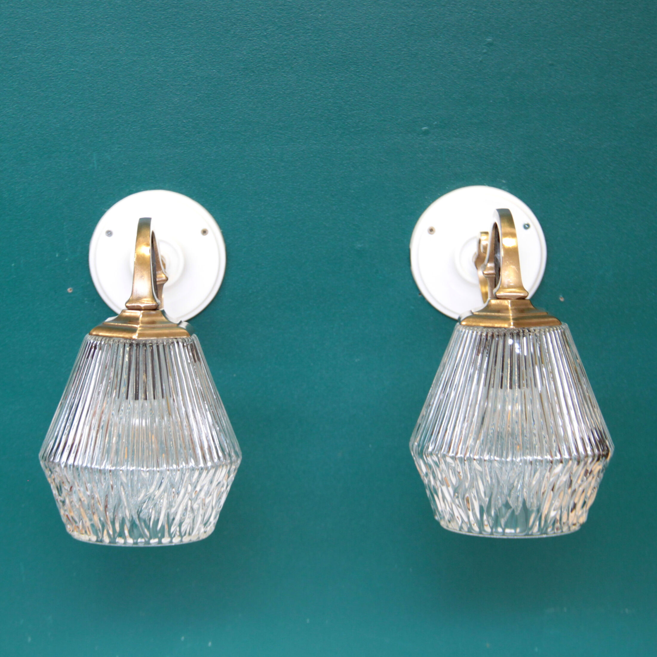 Pair of brass gooseneck wall sconces and glass globe vintage porcelain rosette