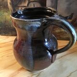 Signed varnished sandstone pitcher