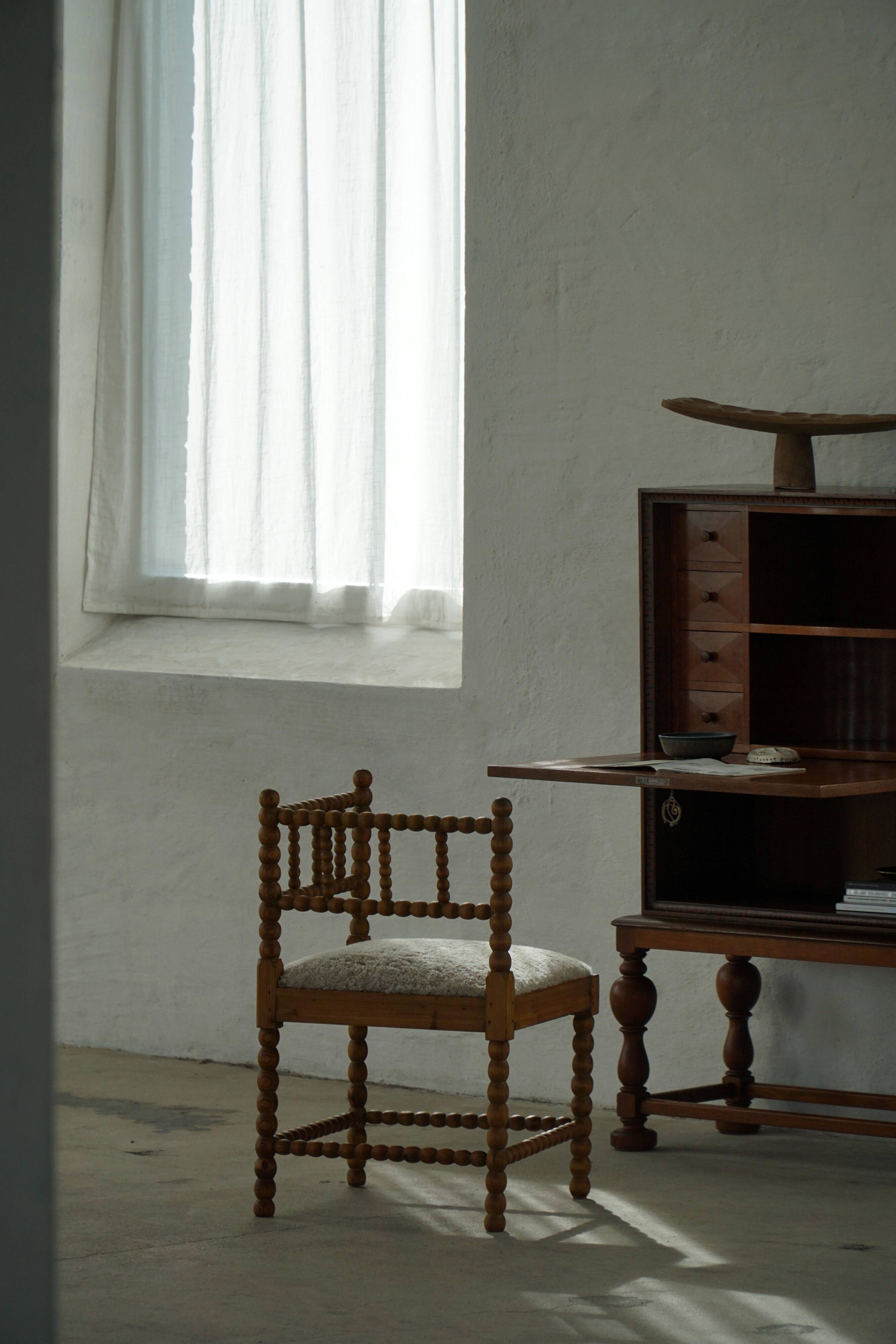 Antique French corner chair handcrafted with lamb's wool, early 20th century.